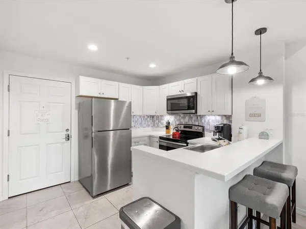 a bedroom with a large bed and a large window
