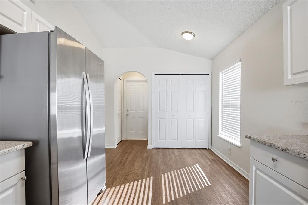 914 Stallion Way Valrico, FL 33594 - Photo 11 of 38 a view of hallway with windows and wooden floor