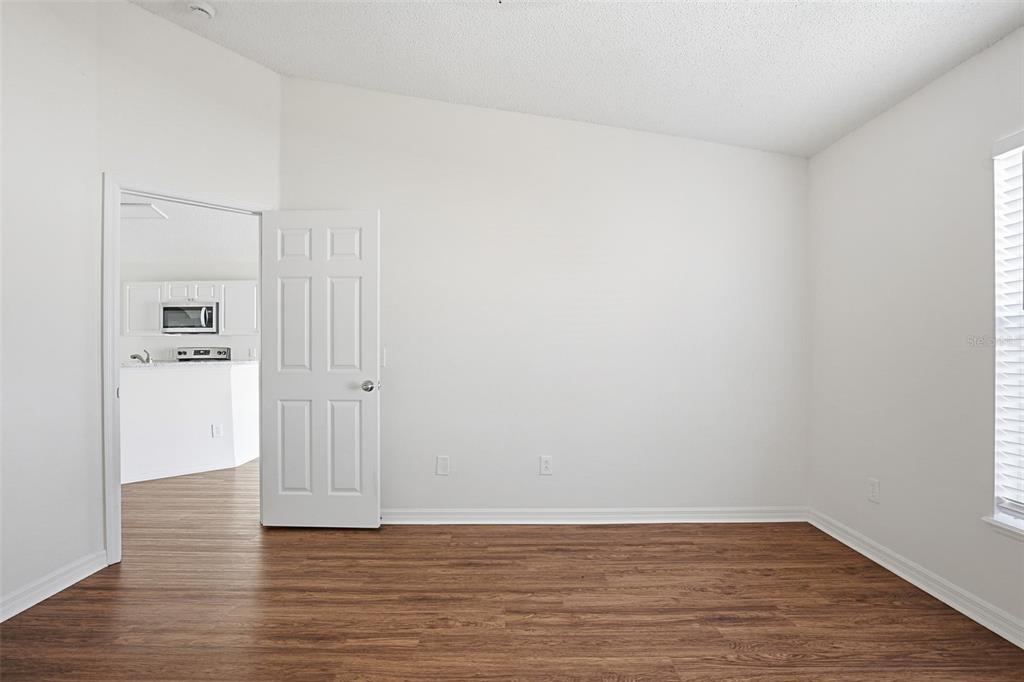 914 Stallion Way Valrico, FL 33594 - Photo 12 of 38 a view of a room with wooden floor