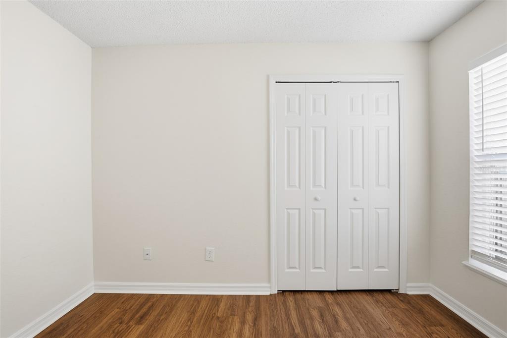 914 Stallion Way Valrico, FL 33594 - Photo 13 of 38 an empty room with wooden floor and windows