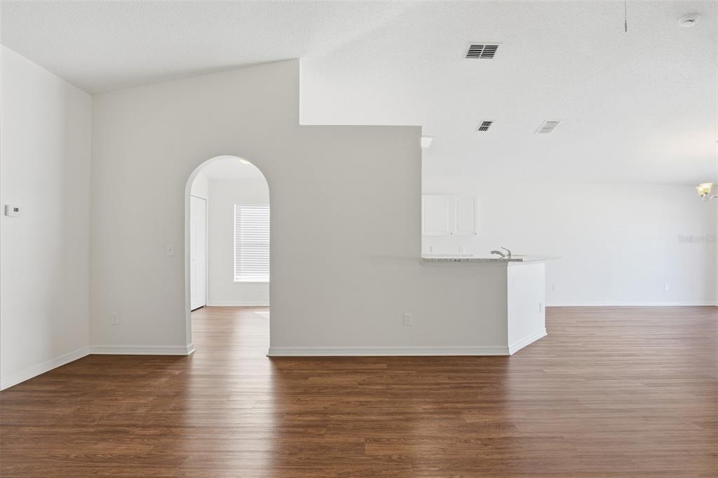 914 Stallion Way Valrico, FL 33594 - Photo 16 of 38 a view of empty room with wooden floor