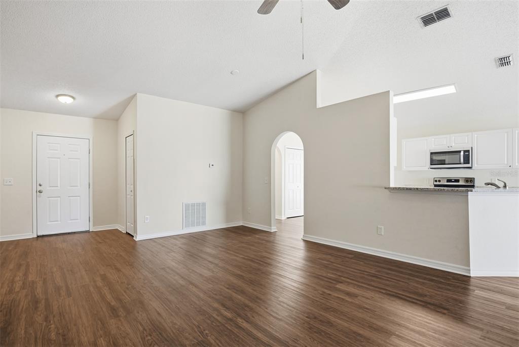 914 Stallion Way Valrico, FL 33594 - Photo 19 of 38 a view of empty room with wooden floor