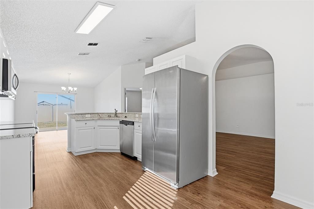 914 Stallion Way Valrico, FL 33594 - Photo 22 of 38 a kitchen with a refrigerator and a stove top oven