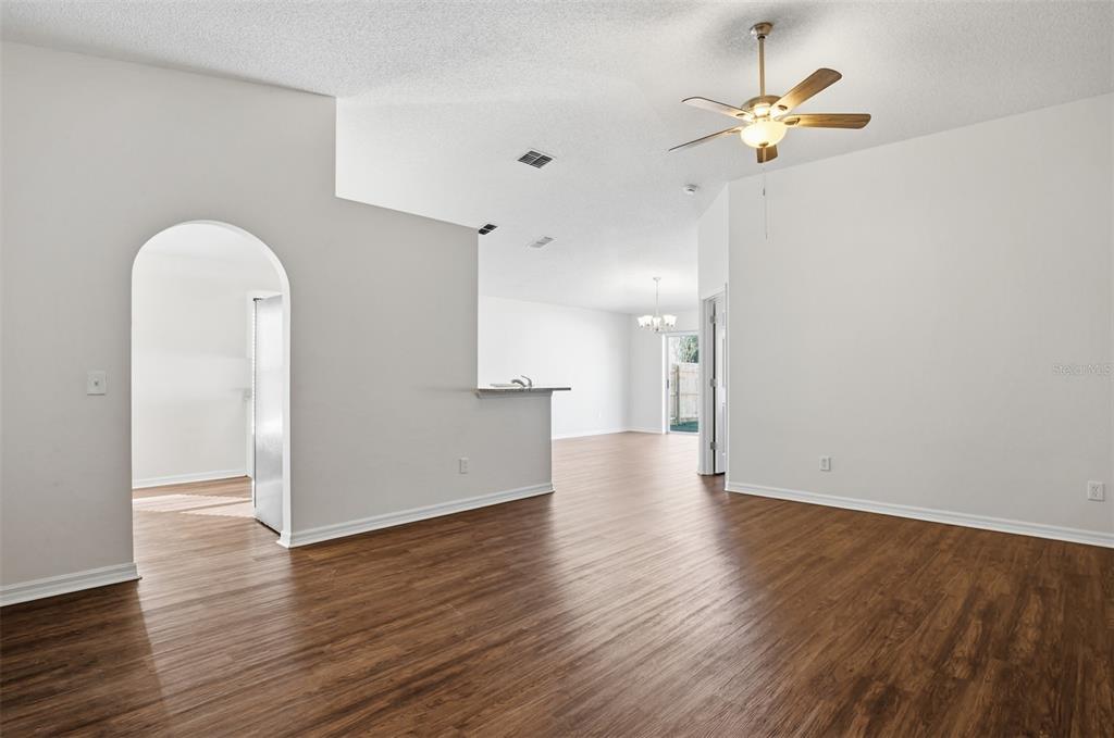 914 Stallion Way Valrico, FL 33594 - Photo 25 of 38 an empty room with wooden floor and windows