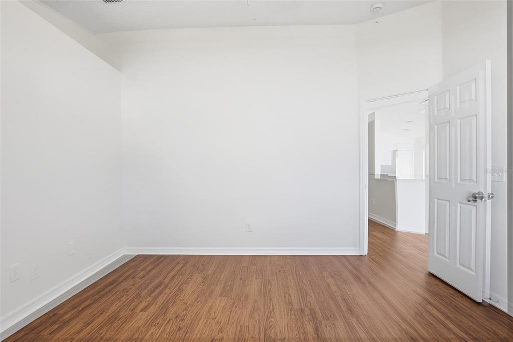 914 Stallion Way Valrico, FL 33594 - Photo 26 of 38 a view of an empty room with wooden floor