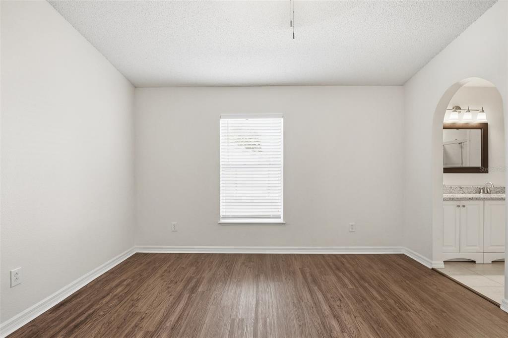 914 Stallion Way Valrico, FL 33594 - Photo 27 of 38 an empty room with wooden floor and windows