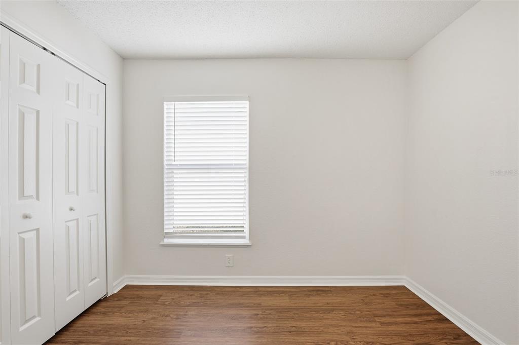 914 Stallion Way Valrico, FL 33594 - Photo 29 of 38 a view of a room with wooden floor and a window