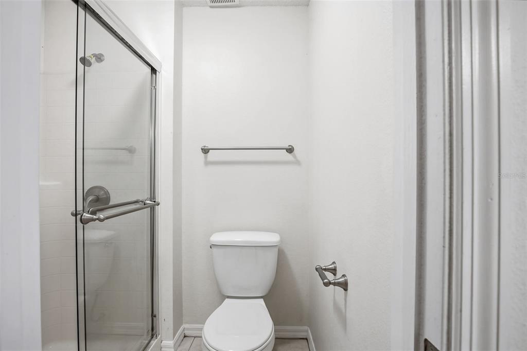 914 Stallion Way Valrico, FL 33594 - Photo 32 of 38 a bathroom with a toilet and a shower