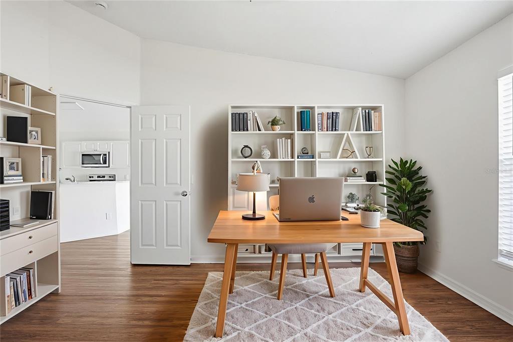 914 Stallion Way Valrico, FL 33594 - Photo 5 of 38 a workspace with furniture and wooden floor
