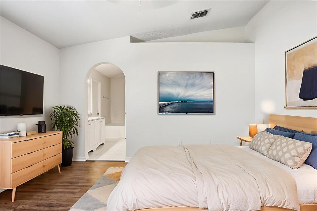 914 Stallion Way Valrico, FL 33594 - Photo 7 of 38 a bedroom with a bed and a flat screen tv