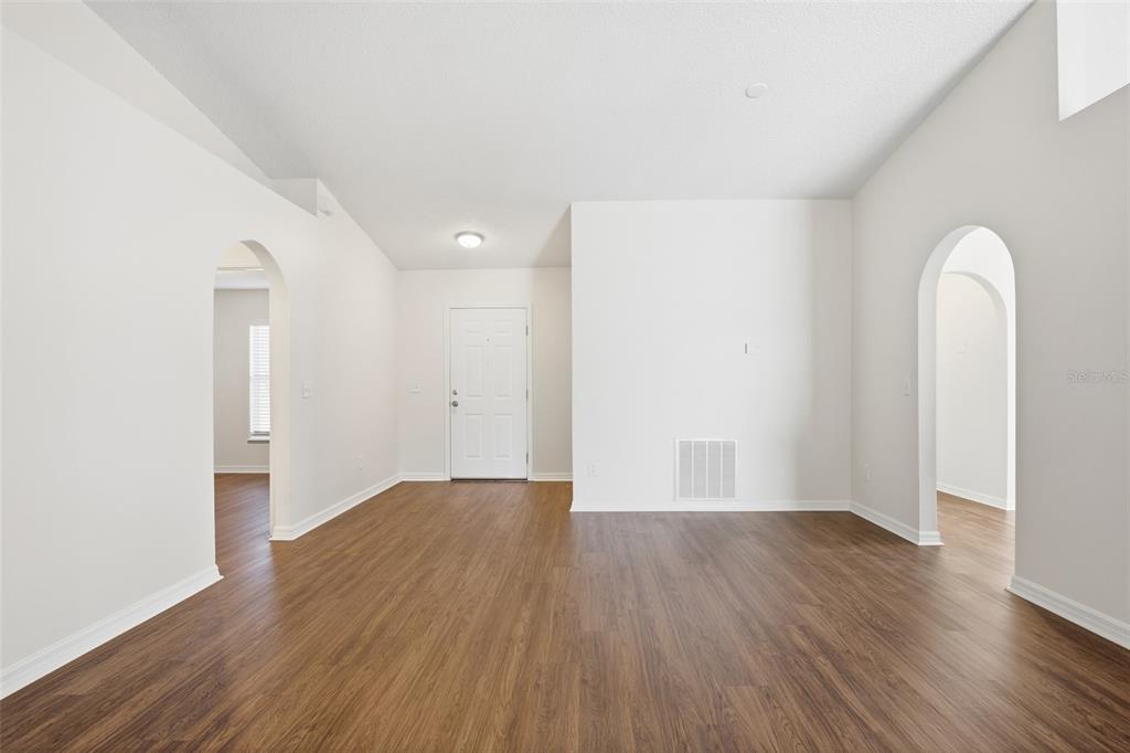 914 Stallion Way Valrico, FL 33594 - Photo 8 of 38 an empty room with wooden floor and window