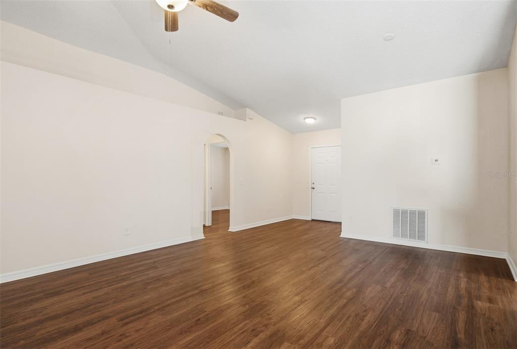 914 Stallion Way Valrico, FL 33594 - Photo 9 of 38 a view of an empty room with wooden floor