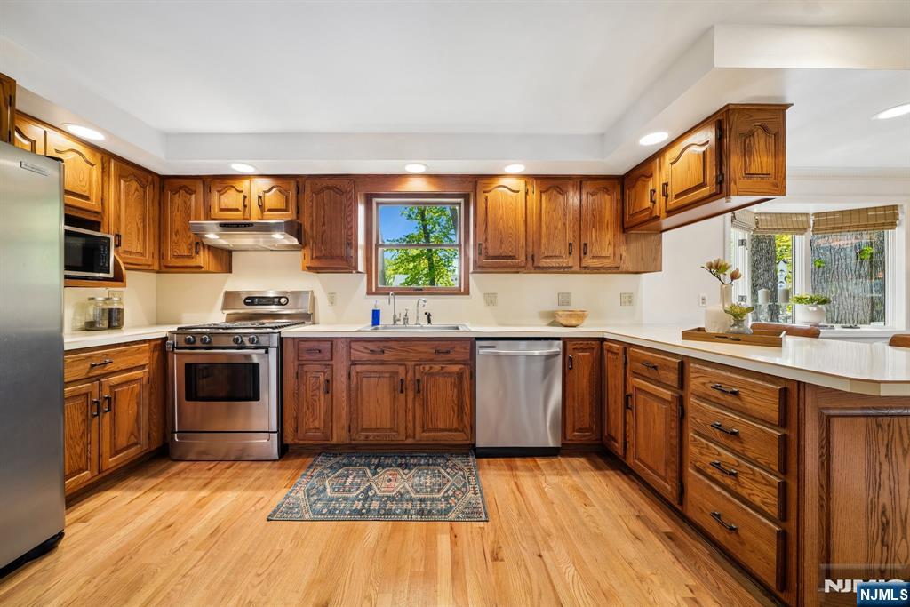 99 Ferncliff Road Bloomfield, NJ 07003 - Photo 13 of 30 a kitchen with stainless steel appliances granite countertop a stove a sink dishwasher and a refrigerator
