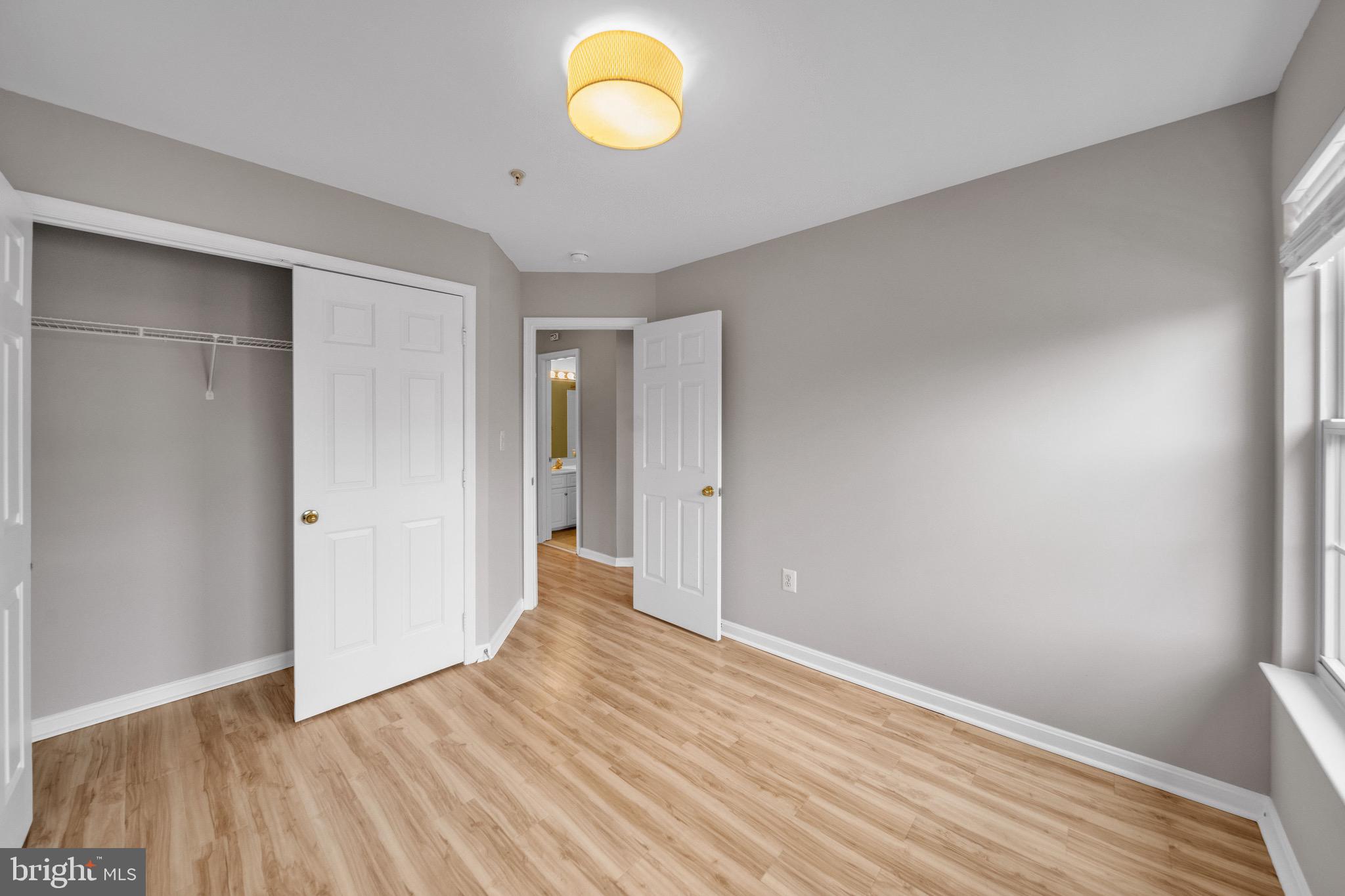 122 Longpoint Way Gaithersburg, MD 20878 - Photo 13 of 37 a view of wooden floor and windows in a room