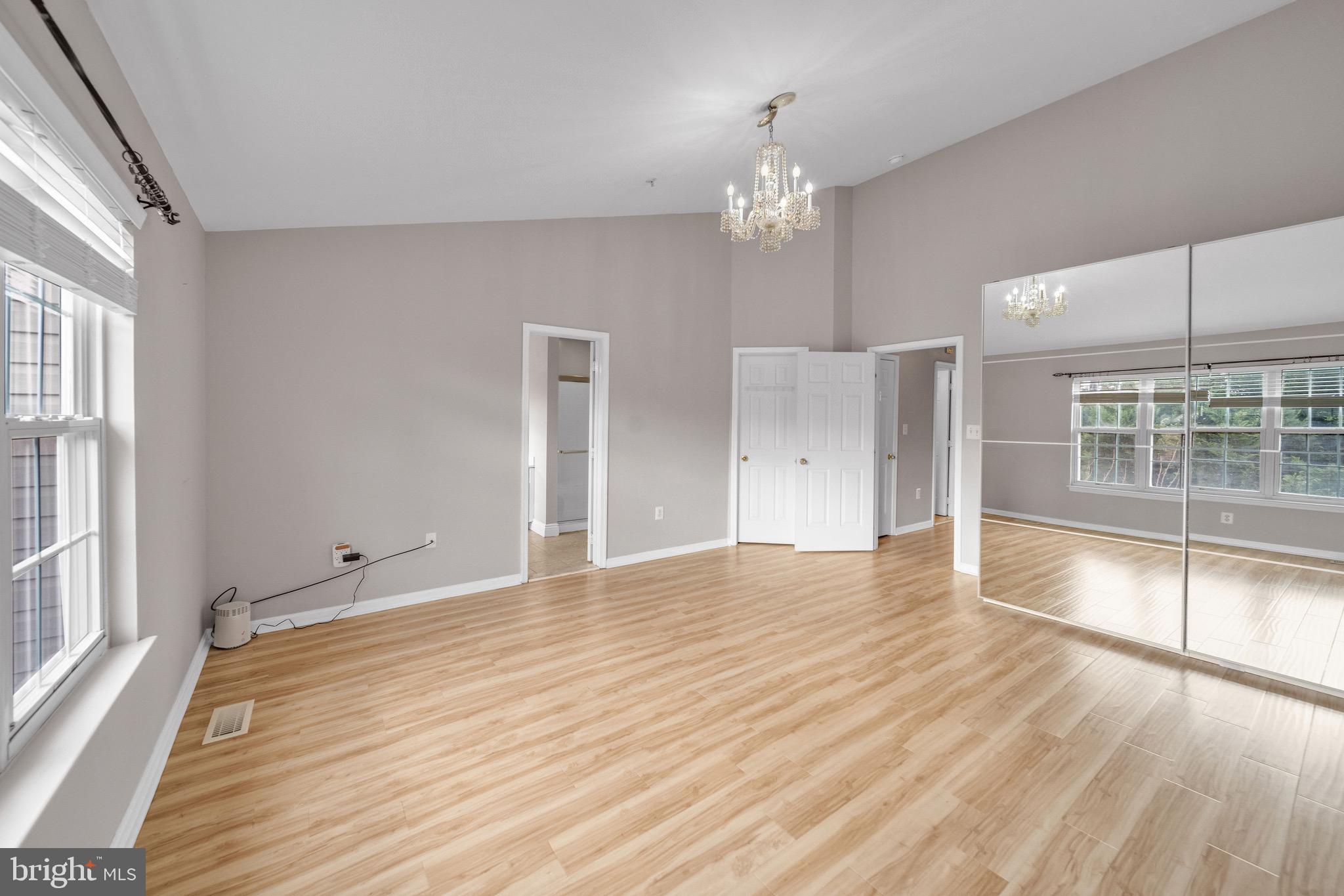 122 Longpoint Way Gaithersburg, MD 20878 - Photo 16 of 37 a view of empty room with wooden floor and fan