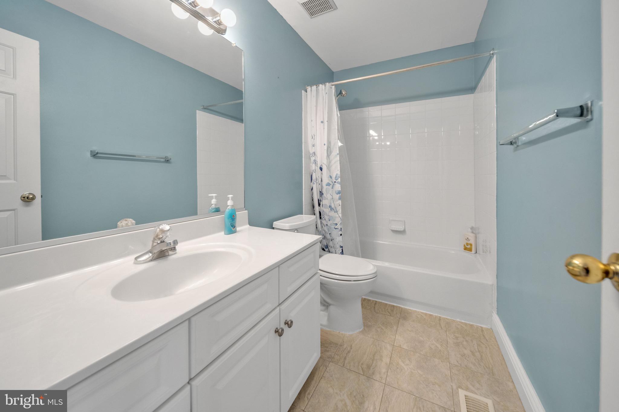 122 Longpoint Way Gaithersburg, MD 20878 - Photo 21 of 37 a bathroom with a sink toilet and shower