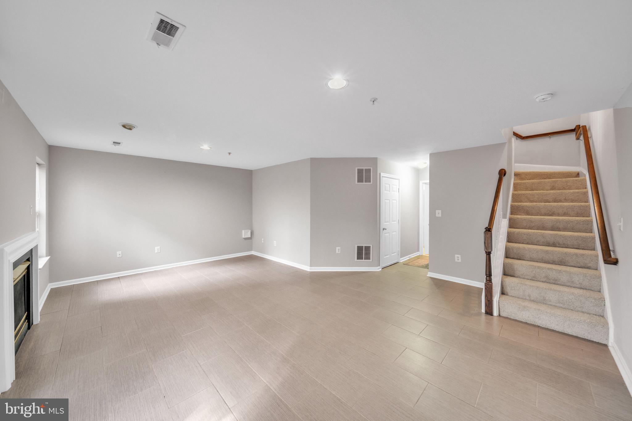 122 Longpoint Way Gaithersburg, MD 20878 - Photo 24 of 37 a view of an empty room with a fireplace