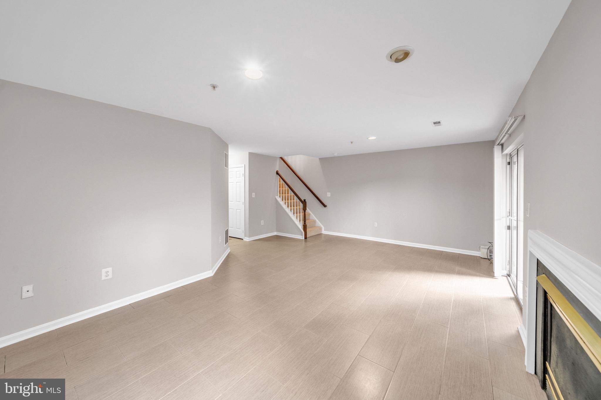 122 Longpoint Way Gaithersburg, MD 20878 - Photo 28 of 37 a view of an empty room with stairs