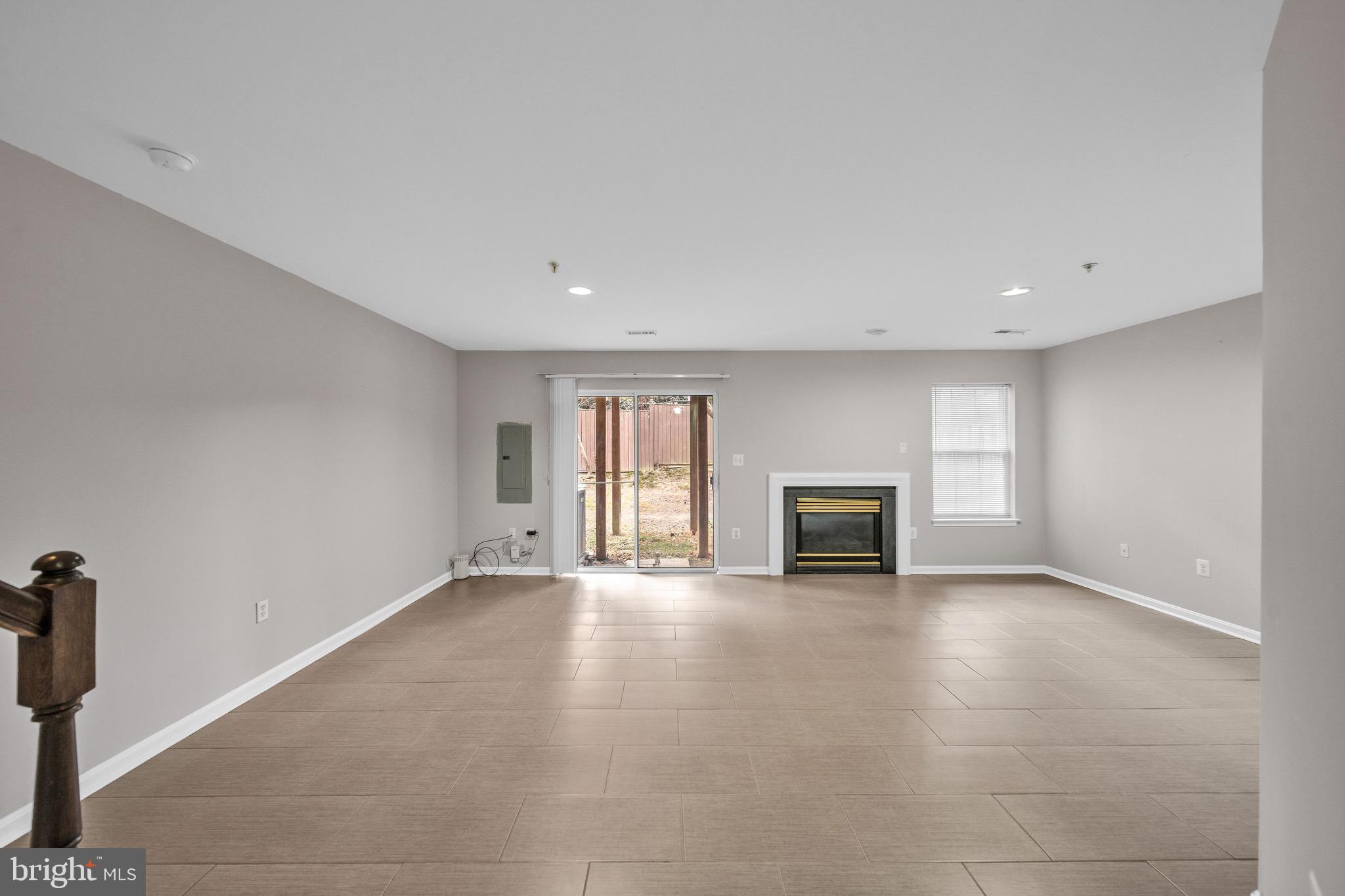 122 Longpoint Way Gaithersburg, MD 20878 - Photo 31 of 37 a view of a livingroom with a fireplace