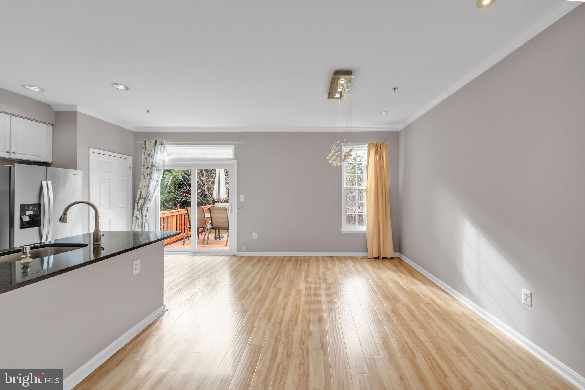 122 Longpoint Way Gaithersburg, MD 20878 - Photo 6 of 37 a view of a room with window and wooden floor