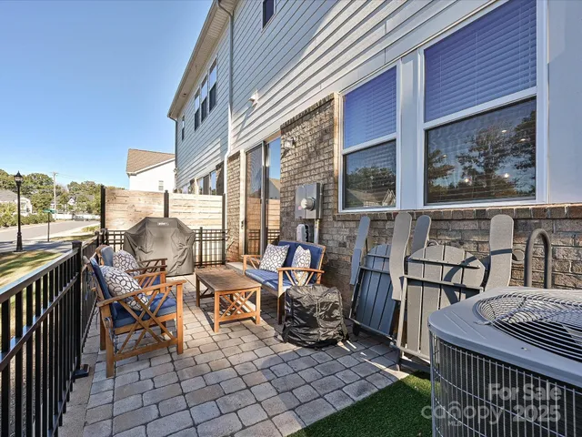 a view of a chairs and table in the balcony