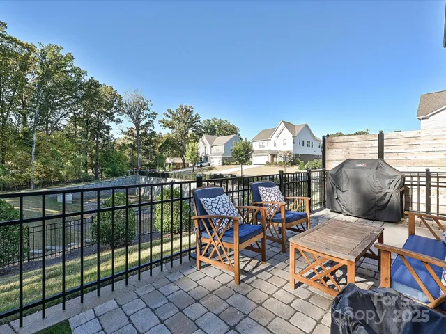 a terrace with outdoor seating and city view