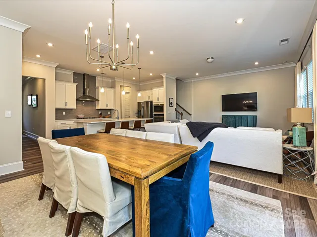 a large kitchen with a table and chairs