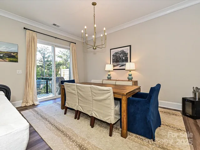 a living room with furniture a table and large window