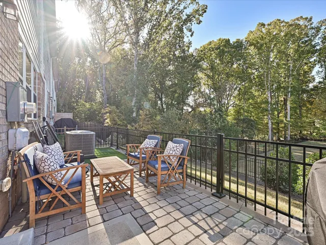 a view of a chairs and table in the patio