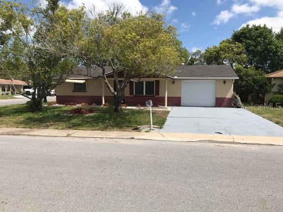 7901 Marlboro Drive Port Richey, FL 34668 - Photo 1 of 1 front view of a house with a street