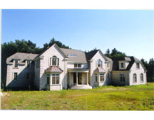 10 Regency Ridge Andover, MA 01810 - Photo 1 of 2 a front view of a house with a yard