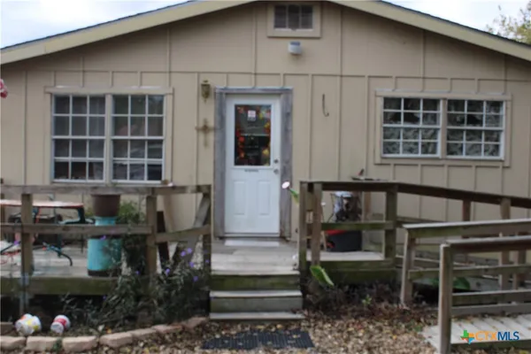 a front view of a house with glass windows