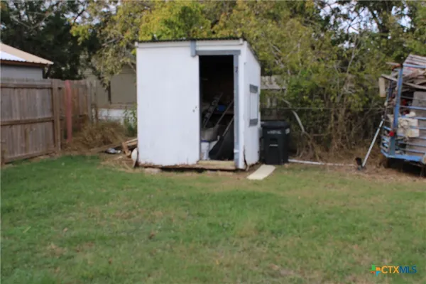 a view of a backyard with parked area