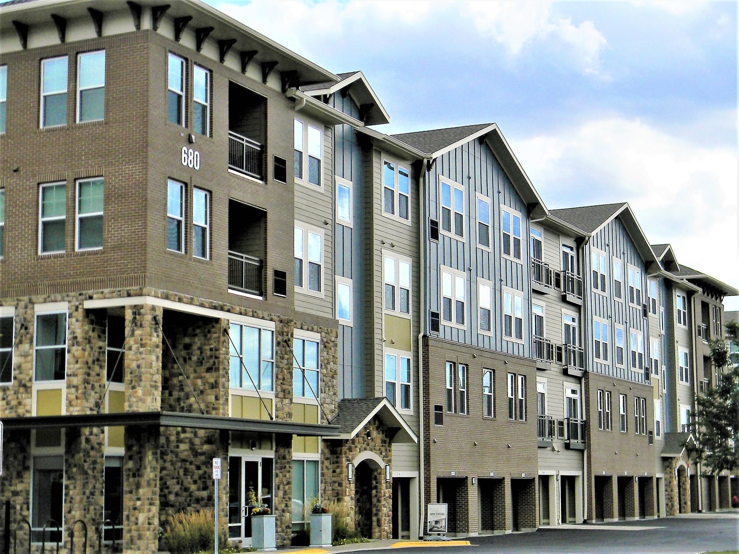 690 East Algonquin Road, Unit 1413 Schaumburg, IL 60173 - Photo 1 of 29 a front view of a building with a lot of windows