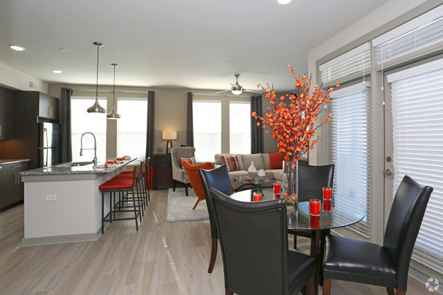 690 East Algonquin Road, Unit 1413 Schaumburg, IL 60173 - Photo 3 of 29 a outdoor dining space with furniture and window