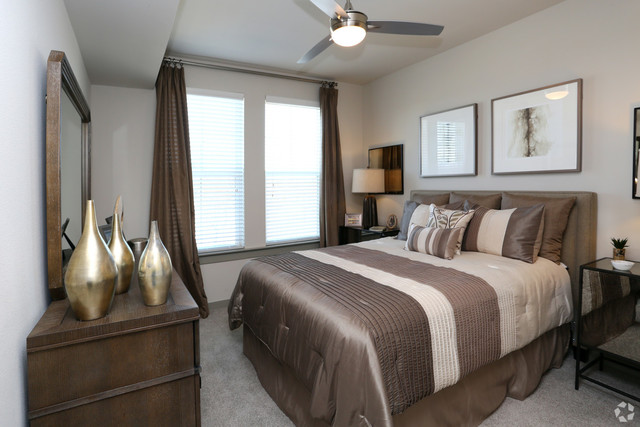 690 East Algonquin Road, Unit 1413 Schaumburg, IL 60173 - Photo 10 of 29 a bedroom with a bed and a telescope