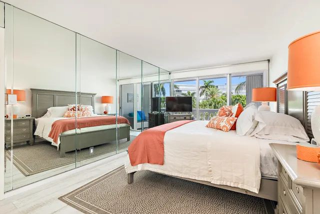 a bedroom with bed and window