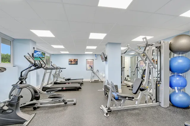 a view of a balcony with an outdoor seating