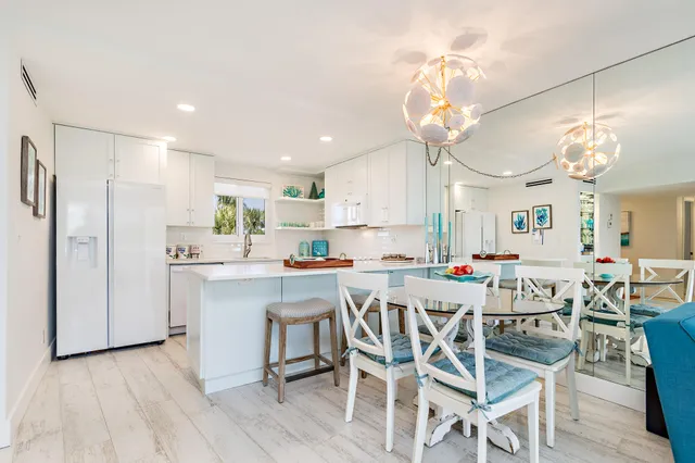 a view of a dining table and chairs in a kitchen