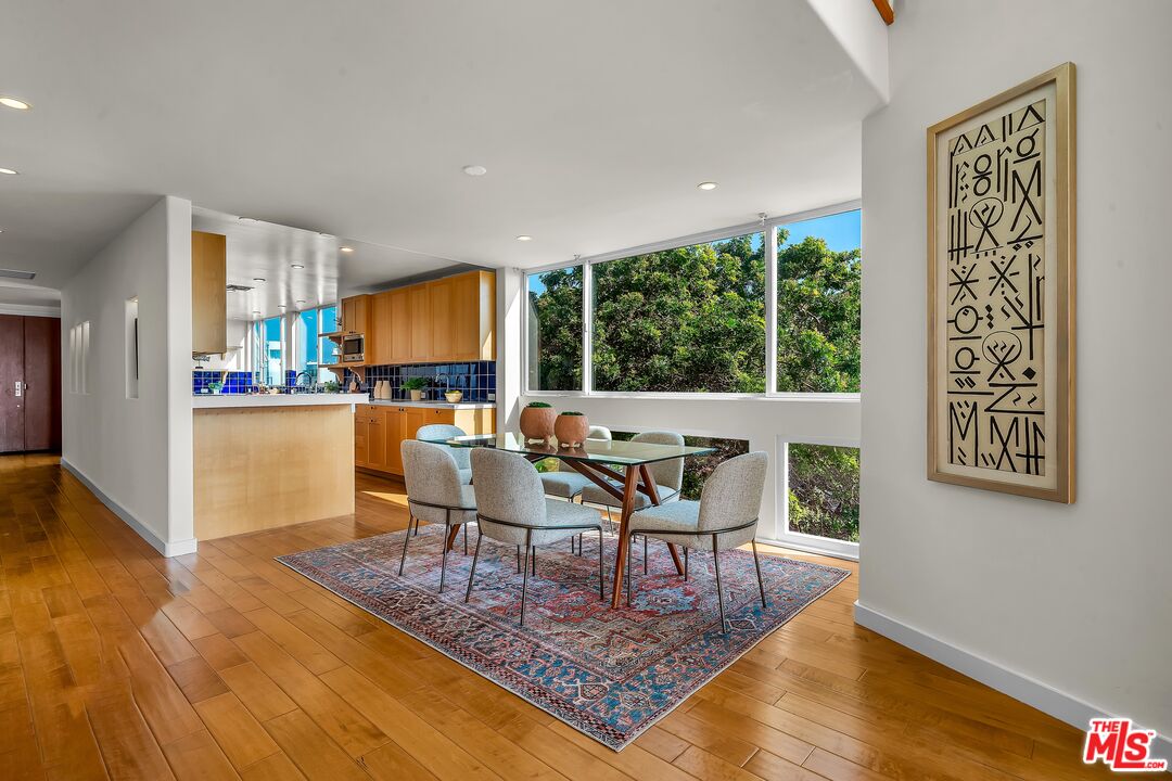 4 Lighthouse Street, Unit 13 Marina del Rey, CA 90292 - Photo 12 of 38 a living room with fireplace furniture and a wooden floor
