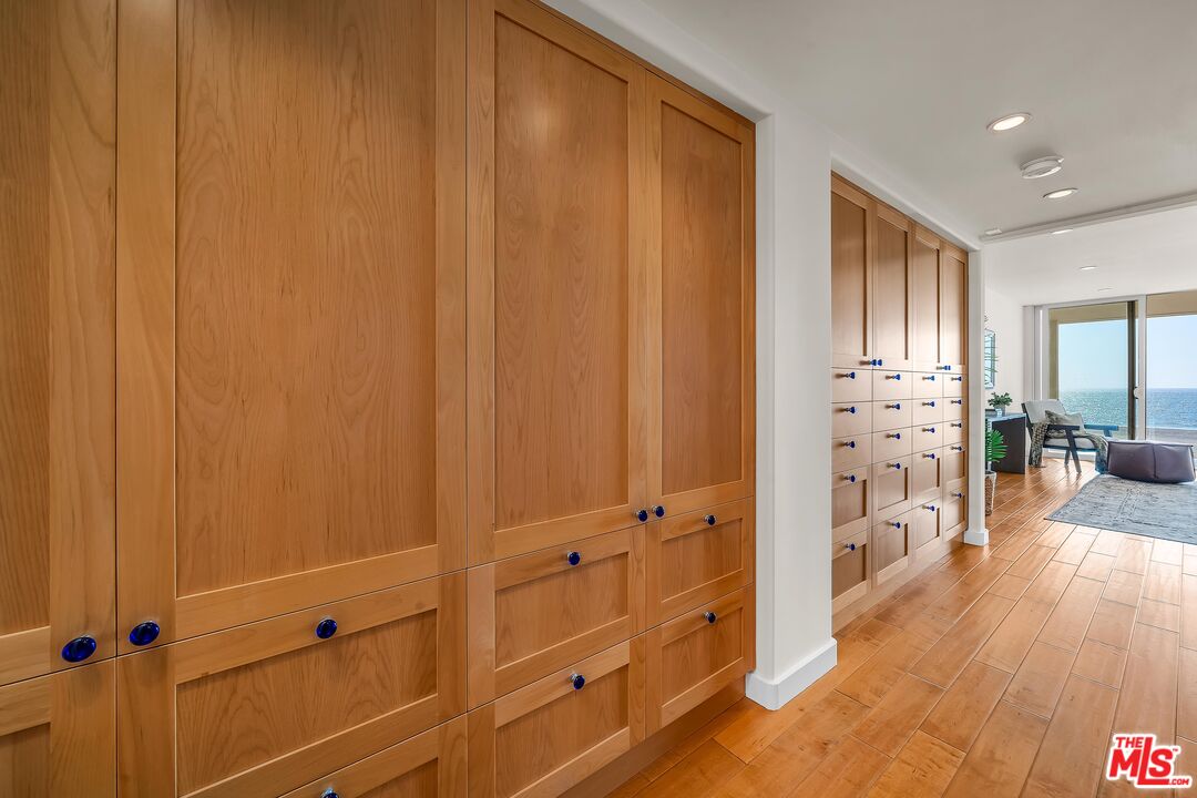4 Lighthouse Street, Unit 13 Marina del Rey, CA 90292 - Photo 24 of 38 a view of a hallway with wooden floor