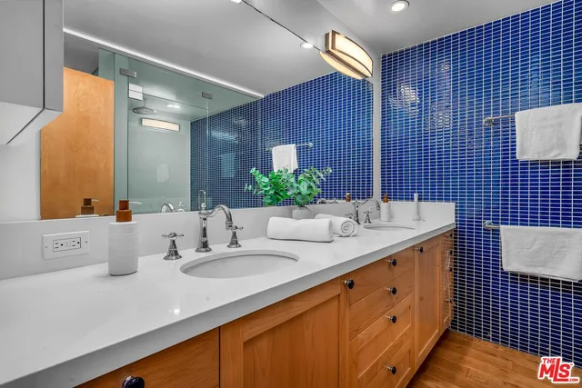 a bathroom with a toilet sink and shower