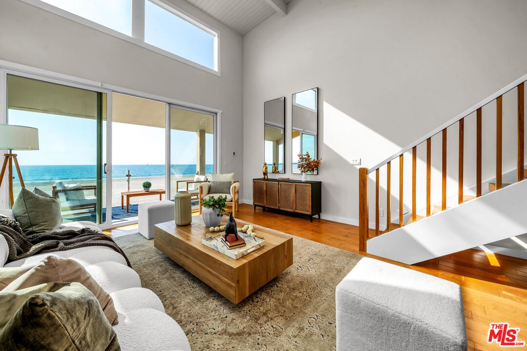 4 Lighthouse Street, Unit 13 Marina del Rey, CA 90292 - Photo 4 of 38 a living room with furniture fireplace and a table