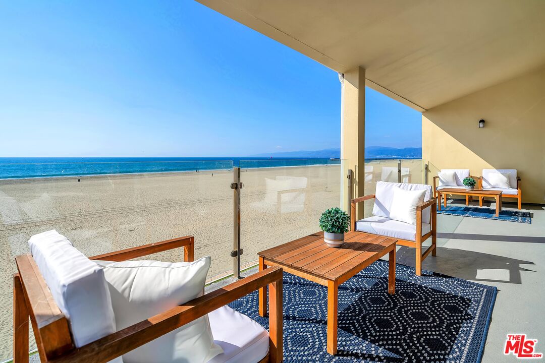 4 Lighthouse Street, Unit 13 Marina del Rey, CA 90292 - Photo 6 of 38 a balcony with seating space and wooden floor