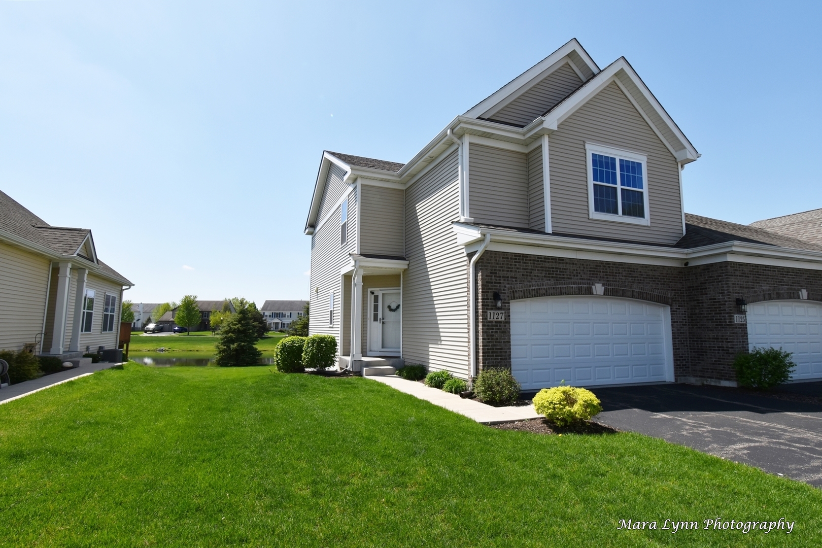 1127 Freedom Road Elburn, IL 60119 - Photo 1 of 29 a front view of a house with a garden