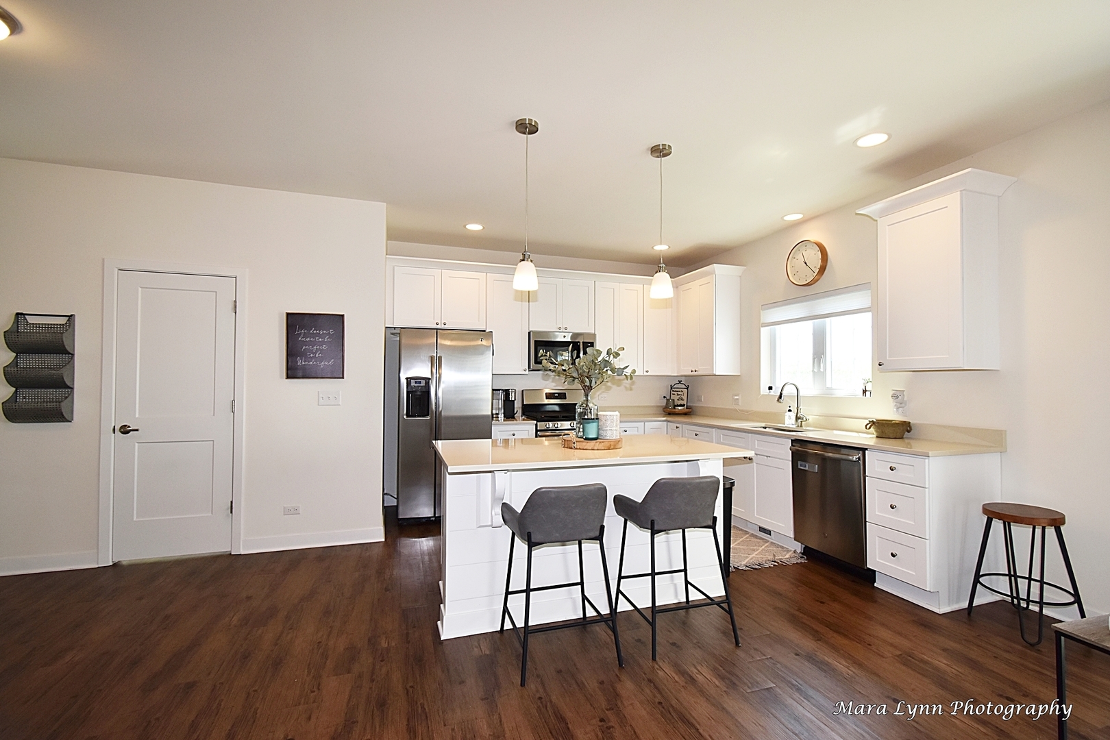 1127 Freedom Road Elburn, IL 60119 - Photo 5 of 29 a large kitchen with cabinets wooden floor and stainless steel appliances