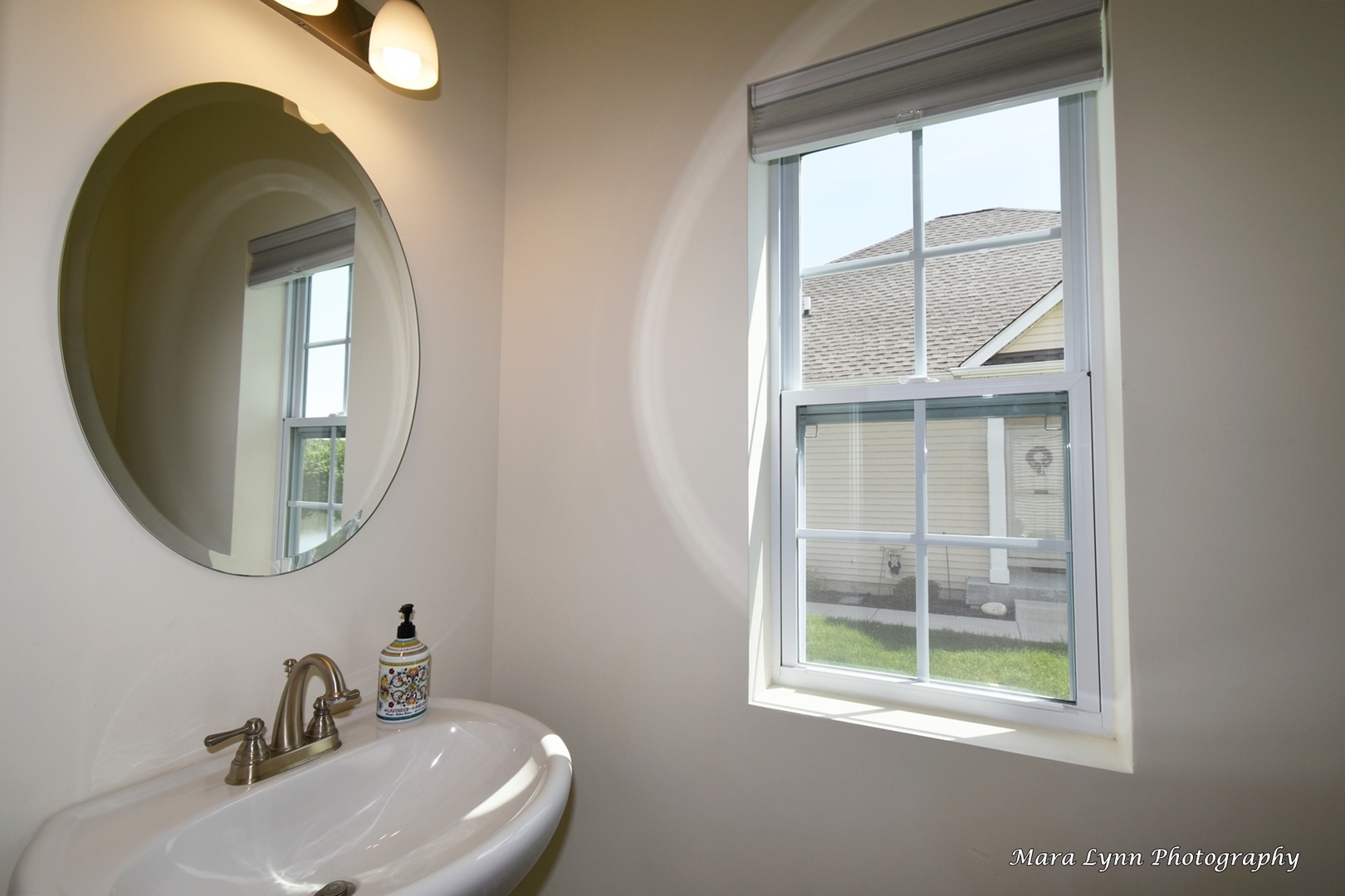 1127 Freedom Road Elburn, IL 60119 - Photo 9 of 29 a bathroom with a sink and a mirror