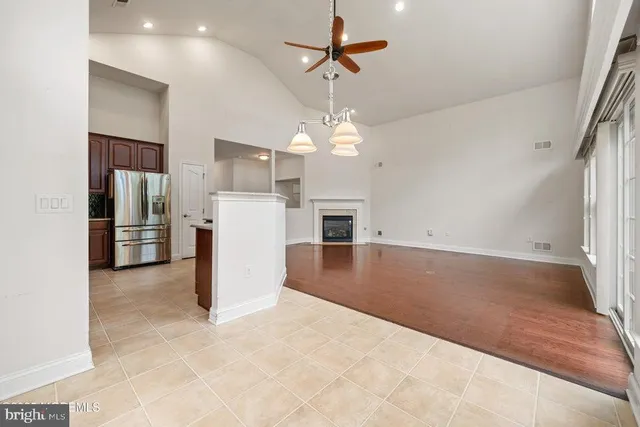 a view of a kitchen with a stove cabinets and a ceiling fan