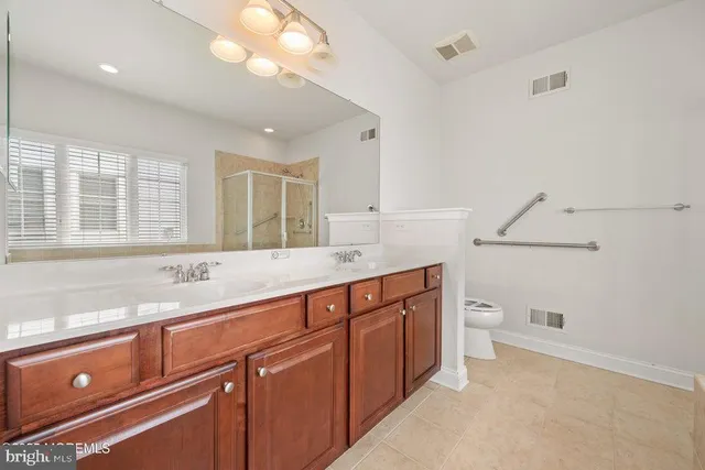 a spacious bathroom with a tub shower and sink