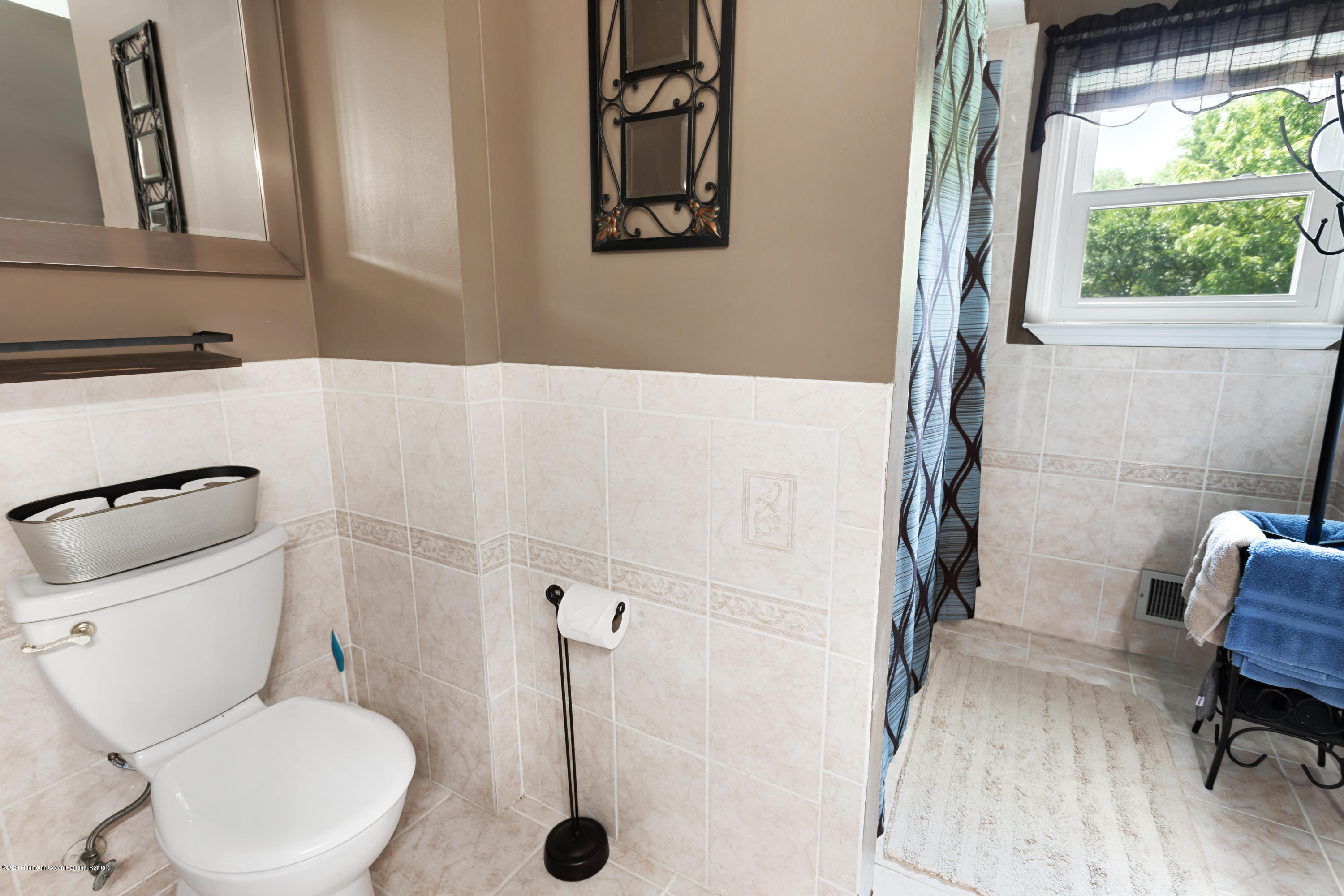 77 East Pleasant Grove Road Jackson, NJ 08527 - Photo 13 of 29 a white toilet sitting next to a bathroom sink